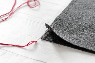 place two sides together and push needle through wrong side of felt