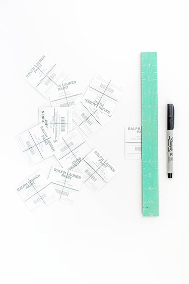 Use a straight edge and marker to divide the paint chips into even sections.