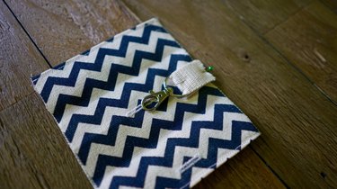 Pin clasp onto fabric for DIY dog waste bag dispenser