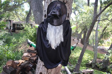 witch on a broom smashing into a tree