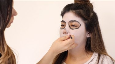 Outline nose in black.