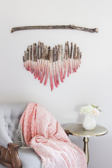 Pink ombre heart wall hanging made from branches