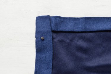 Insert the cap through the fabric