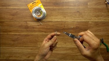 Preparing wire for DIY glass beaded garden sparkler.