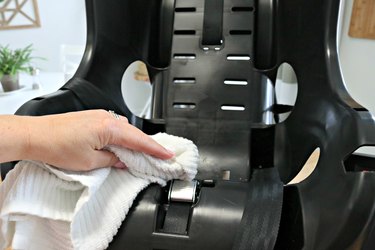 Wiping child's car seat base