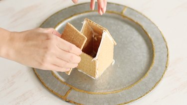 Attaching roof pieces to house