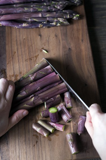 Cutting purple asparagus