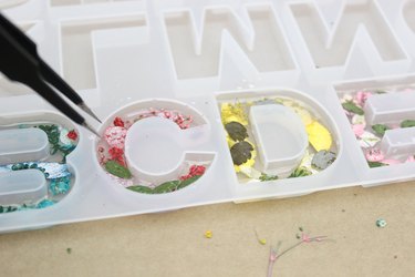 position the flowers in resin