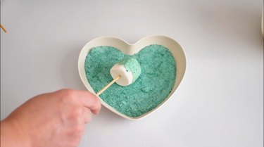 roll marshmallow pop in green sugar