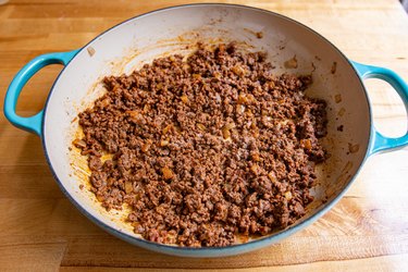 Ground beef cooking in a pan