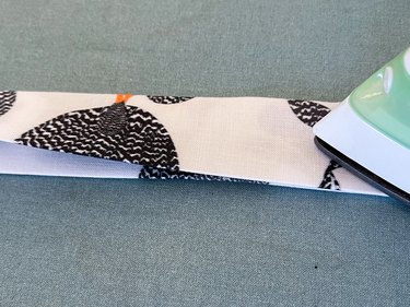 fold in half lengthwise and press again