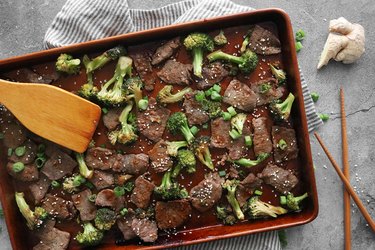 Sheet pan beef and broccoli with chopsticks
