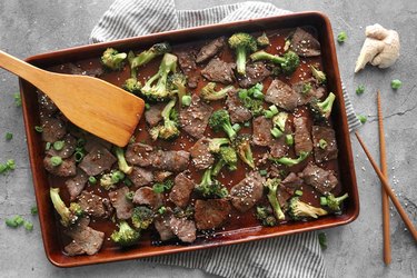 Cooked beef and broccoli on a baking sheet