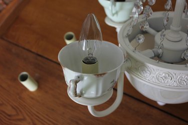 Screw a lightbulb into each socket.