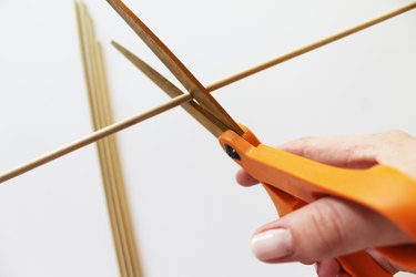 Cut the dowels into 2-foot lengths.
