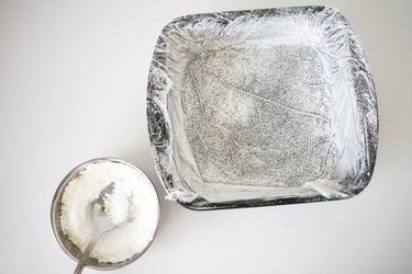 Baking tin coated with powdered sugar and cornstarch.