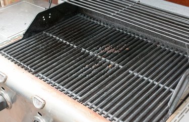 Caked-on drippings, grease and food on a gas grill