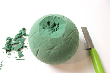 Dig a crater into your floral foam for your pumpkin flower arrangement