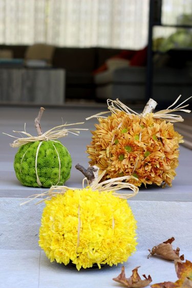 Skip the traditional pumpkins and try these colorful pumpkin-shaped floral arrangements instead.