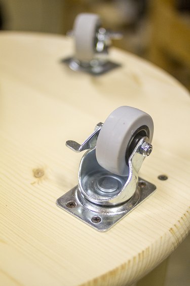 Screw casters onto the bottom of the cart.
