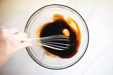 Vigorously whisk in the eggs.