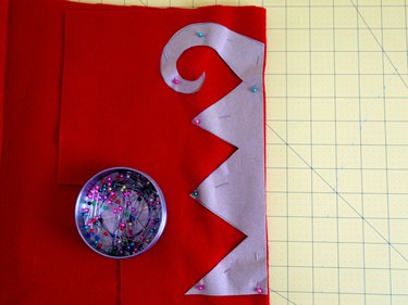 The zigzag design pinned to red felt.