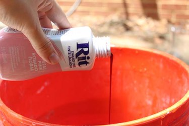 Stir the dye into hot water.