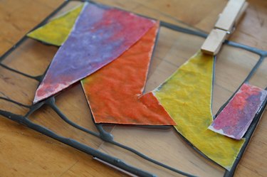 Colorful cut outs matched up against the acrylic picture-frame