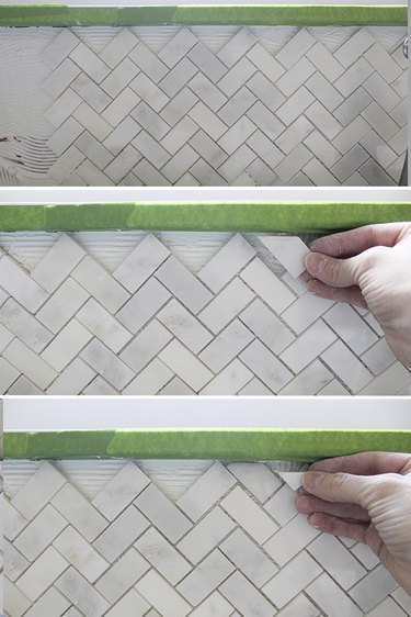 Fitting tiny pieces of tile in.