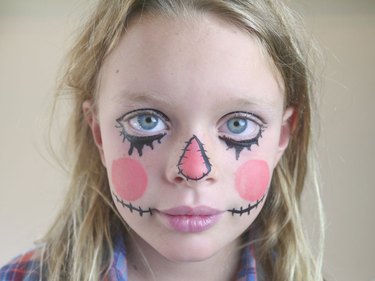 The peach nose outlined in black stitches.