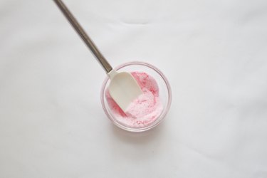 Mix food coloring in sugar