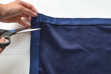 Pierce a hole with one blade of the scissors