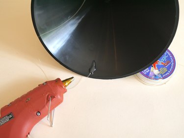 Stretch cord glued to the inside of the funnel.