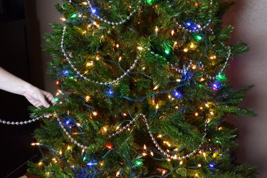 Drape beads around the tree