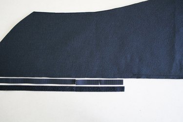 Sew the center back together below the notch and cut a piece of hook-and-loop tape.