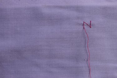 Inserting the needle through the bottom of the vertical stitch for zig zag stitch