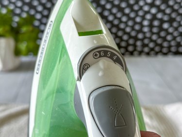 Turn iron to its hottest steam setting