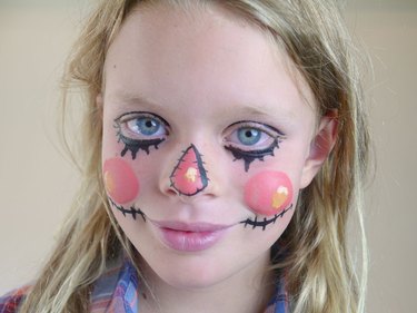 The finished face with highlights added to the cheeks and nose