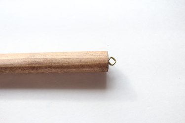 Screw eye hooks to either end of top dowel.