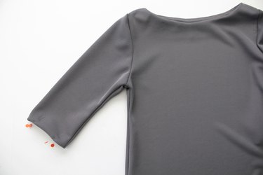 Hem the dress with a zigzag stitch, double needle or stretch stitch