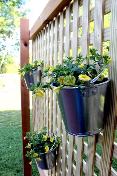 galvanized paint cans make great flower buckets