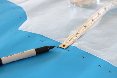 Measure and mark a half inch from the wax paper.