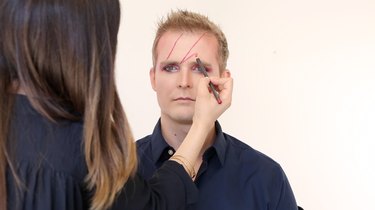 Drawing outline of lightning bolt in red liner
