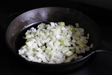 Chopped onion in a cast iron skillet