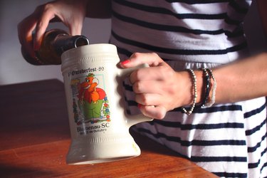 pouring beer into a stein
