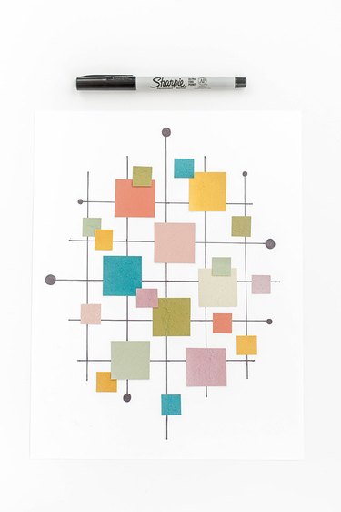 Finish by adding a few extra cut paint chips and small circles at the edges of the grid.
