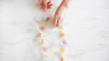 Tying ends of cellophane together