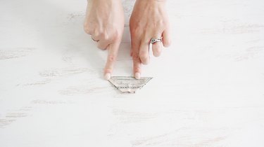 Folding bill in half