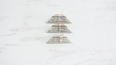 Three folded bills
