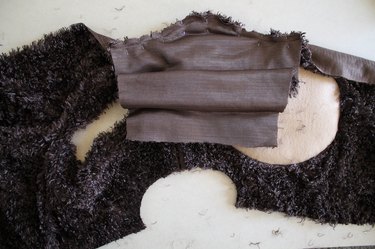 It is easier to sew the sleeve if you sew it before the side seam.
